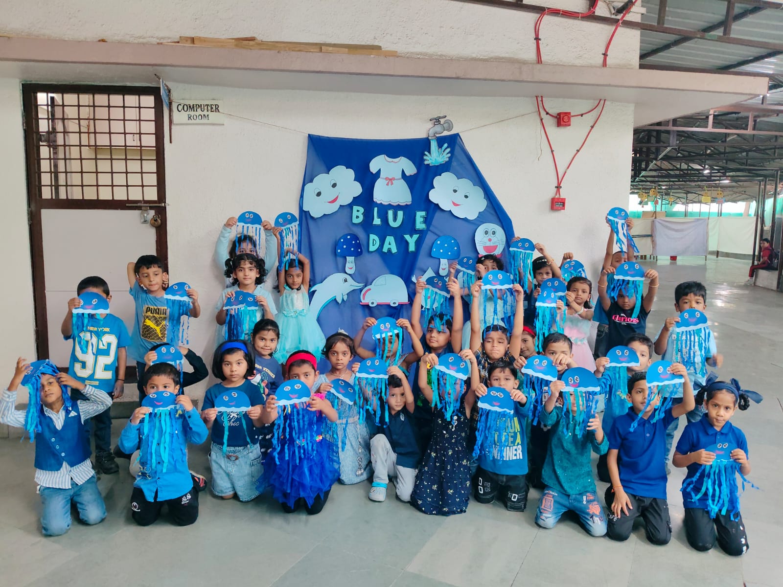 Nursery - Child holding Raindrop Cloud craft