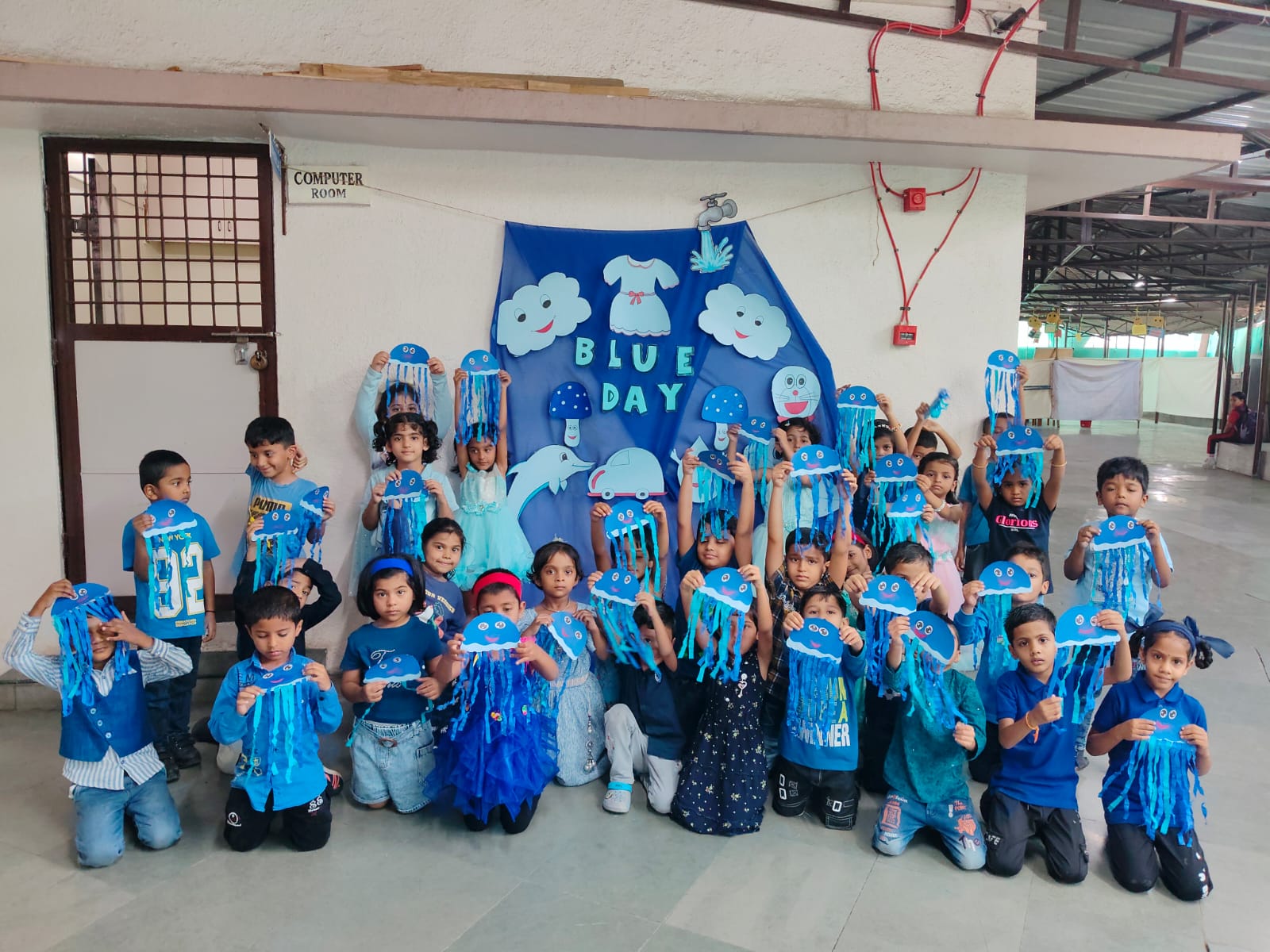 UKG - Child showcasing Jellyfish art