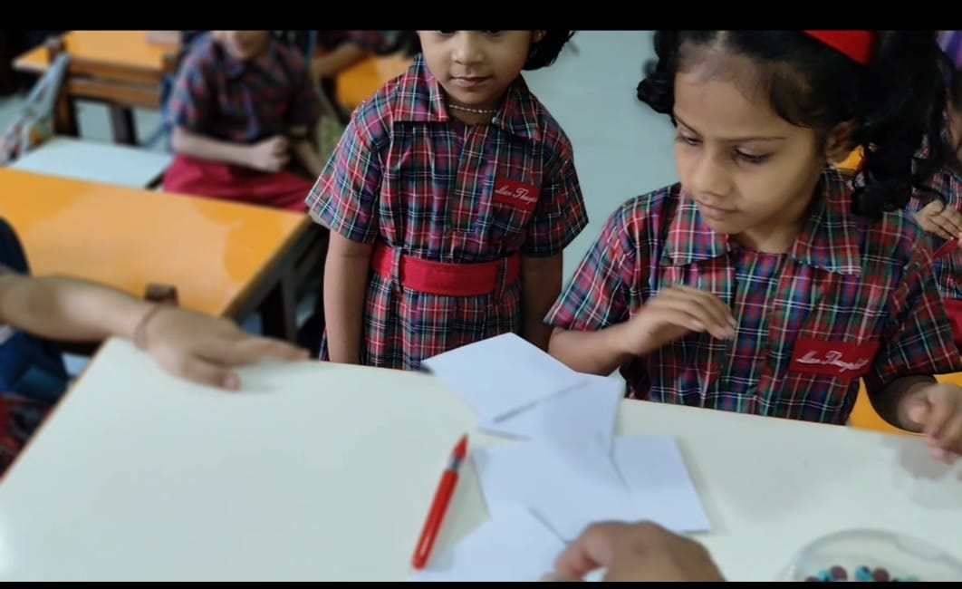 Students checking count accuracy with teacher help