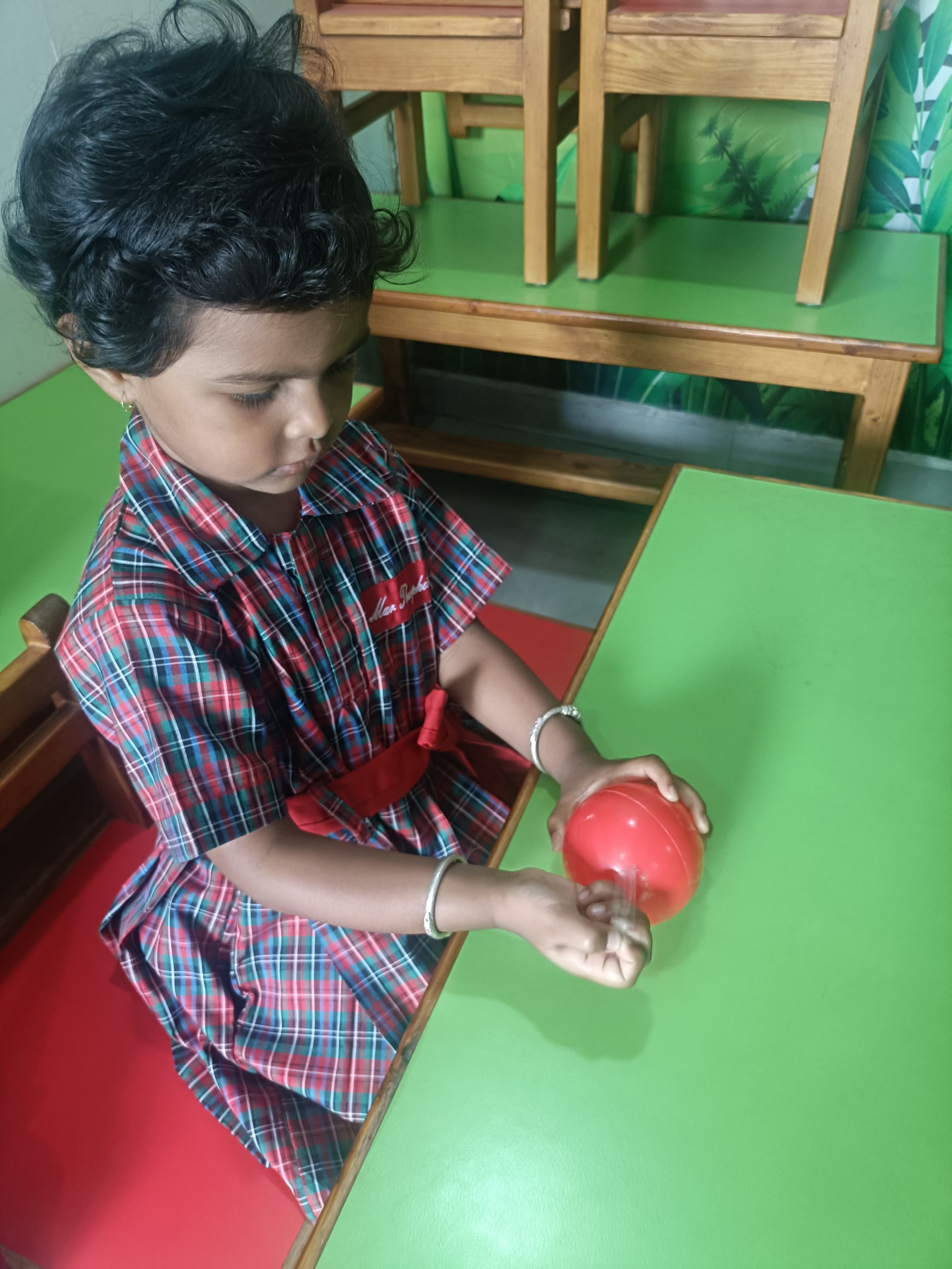 Wrapping tape around plastic ball for grip development