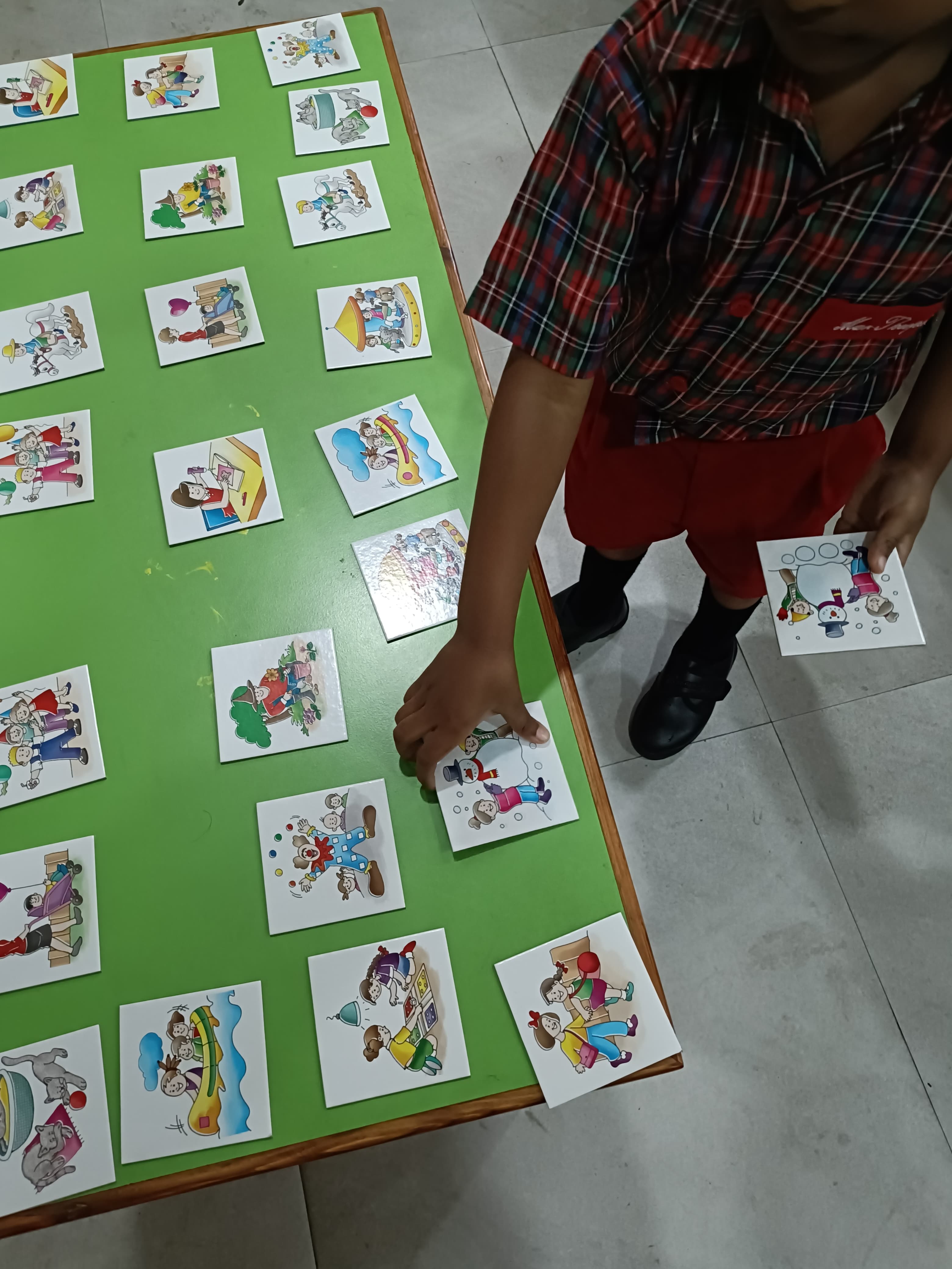 Table grid layout of card matching pairs game