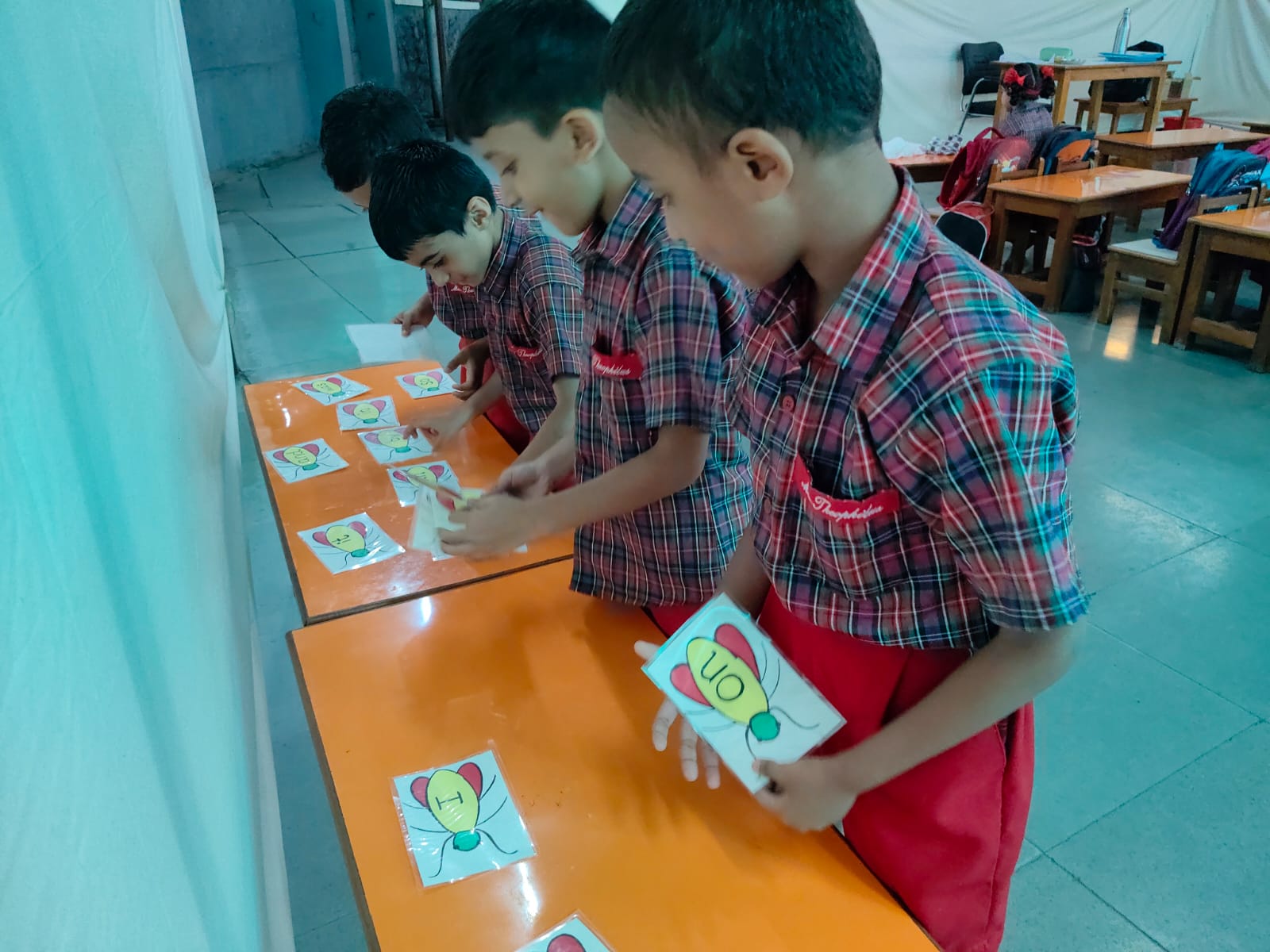 UKG - Student participating in sight words matching