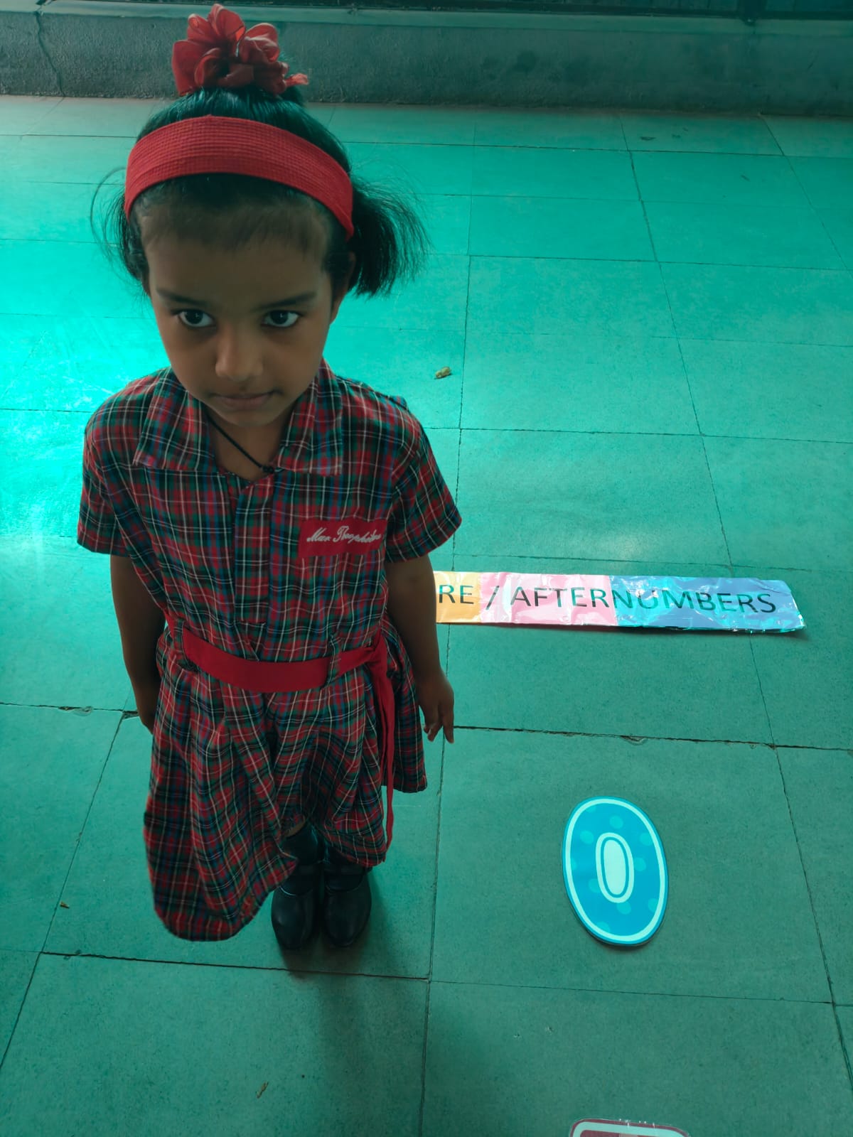 Child standing on floor numbers outline